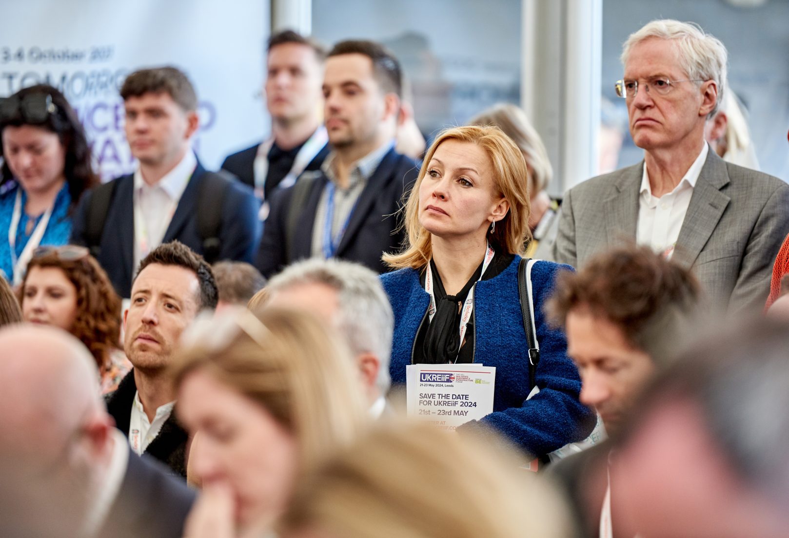 Image of people listening to a panel at UKREiiF