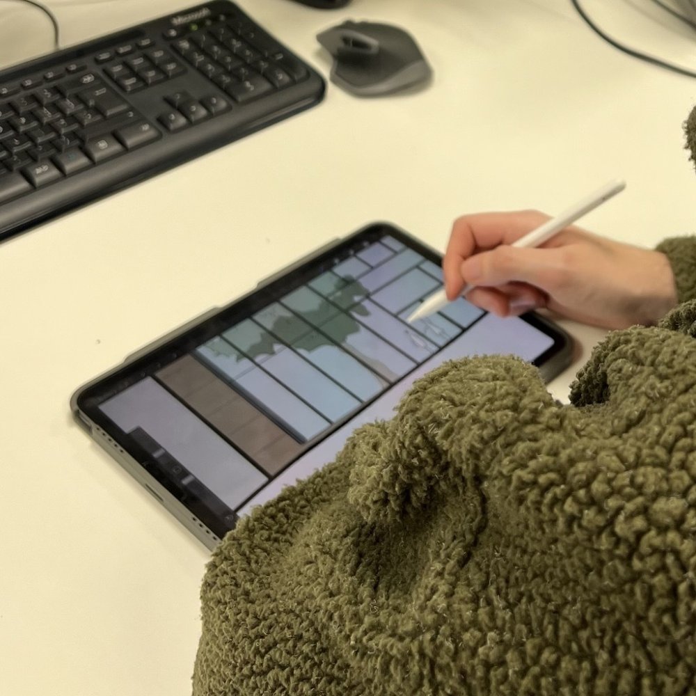 Person designing on iPad.