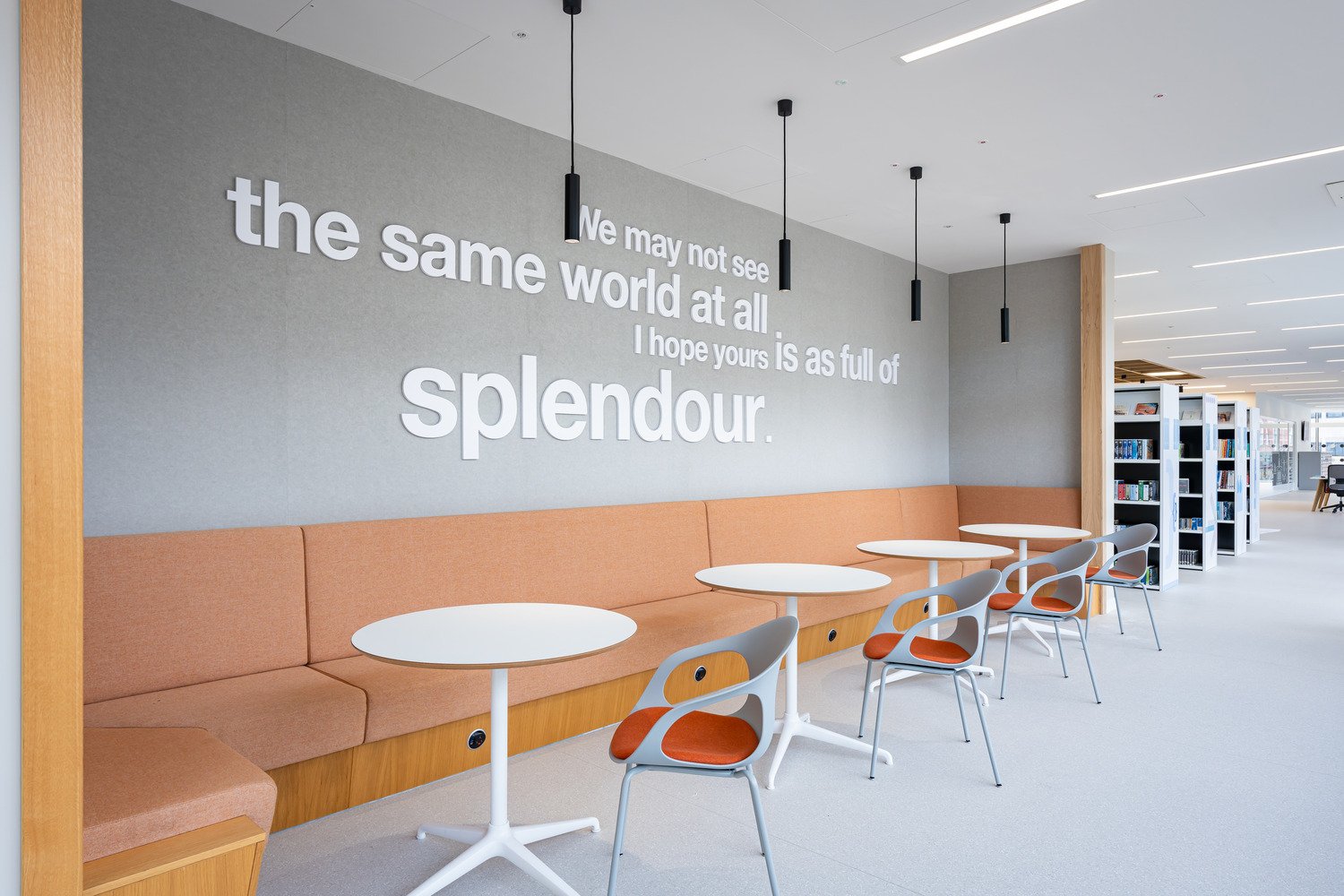 Library seating area with quote on wall