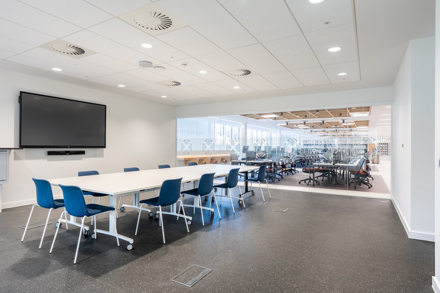 Modern library meeting room with TV