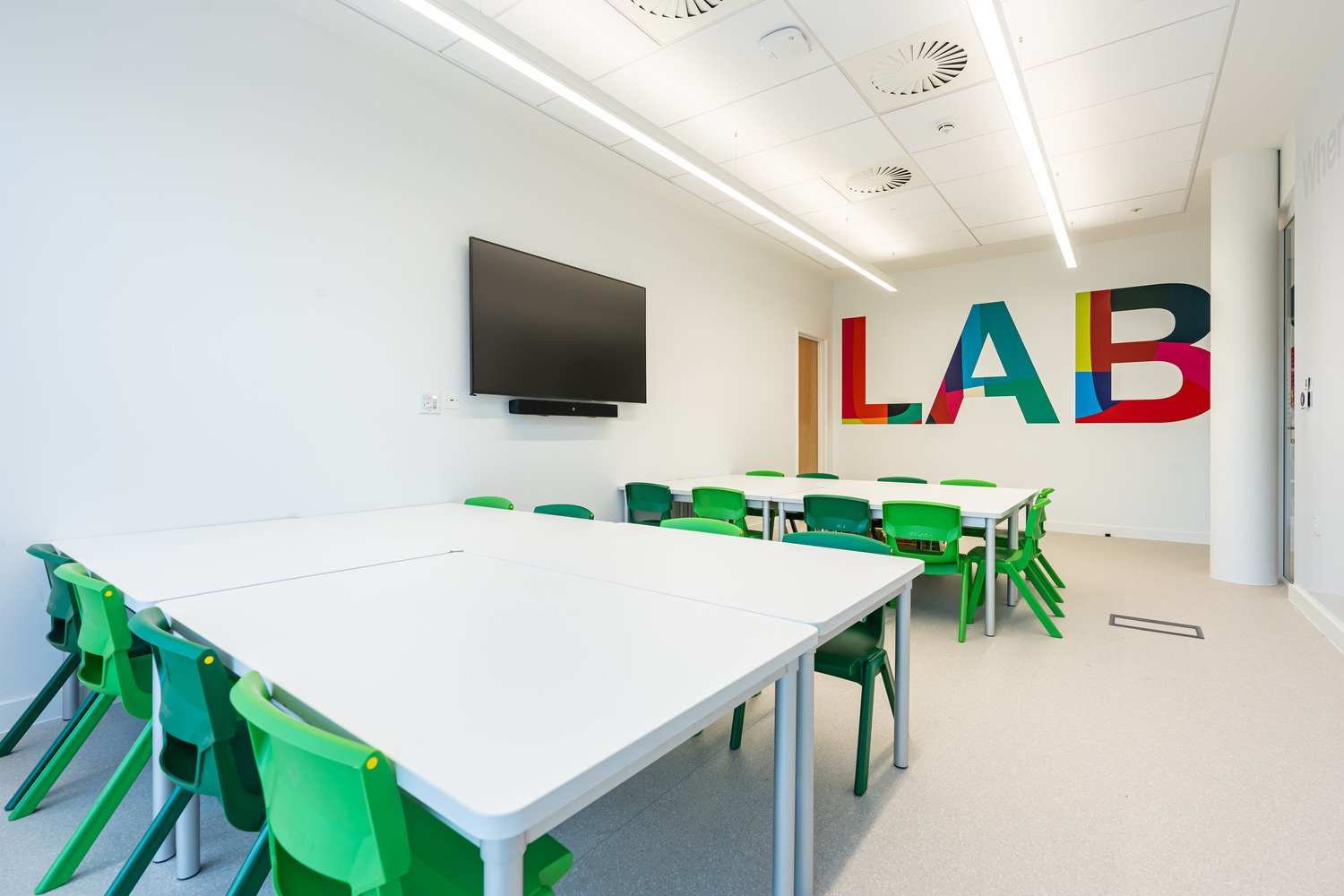 Brightly coloured classroom with LAB sign