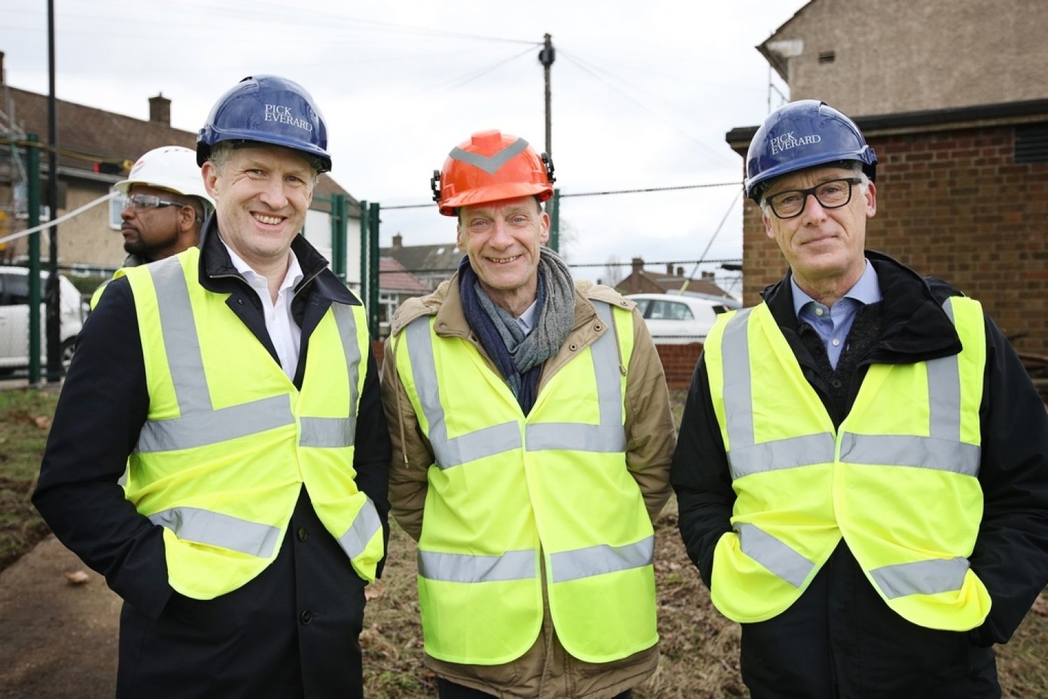 Matt Hall, Paul Hawkins, and Simon Hembury, stood next to each other with hardhats and high vis vests on