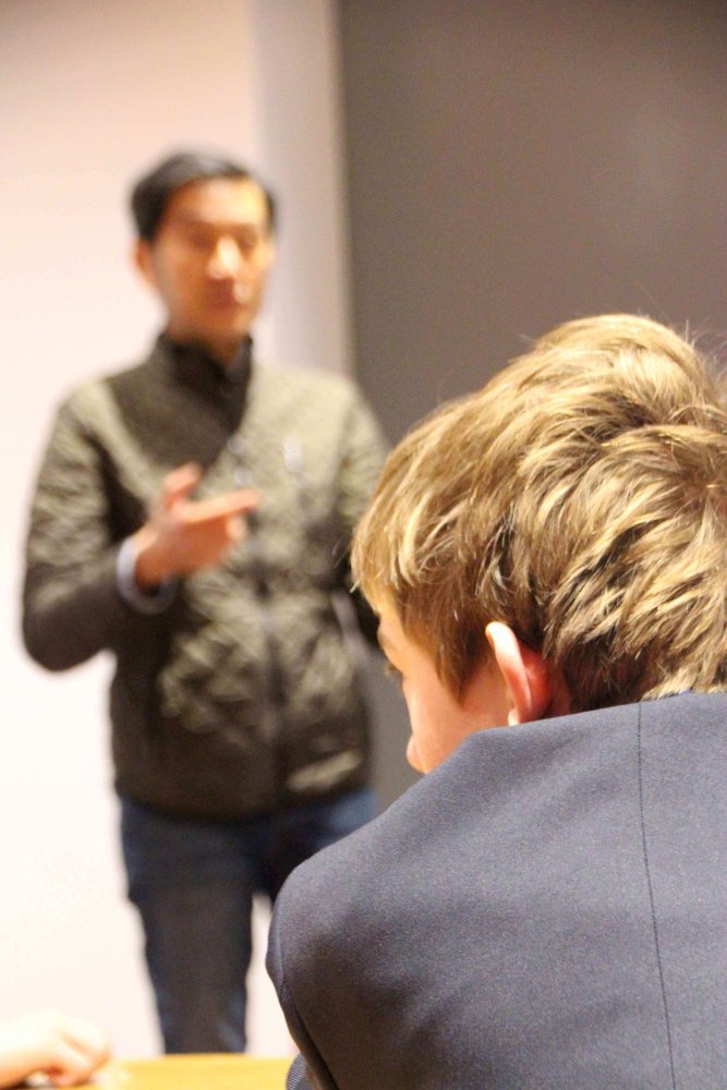 Chong Wong teaching children about VR headsets