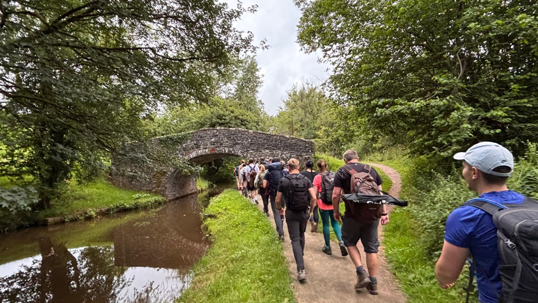 Group walking along a canal