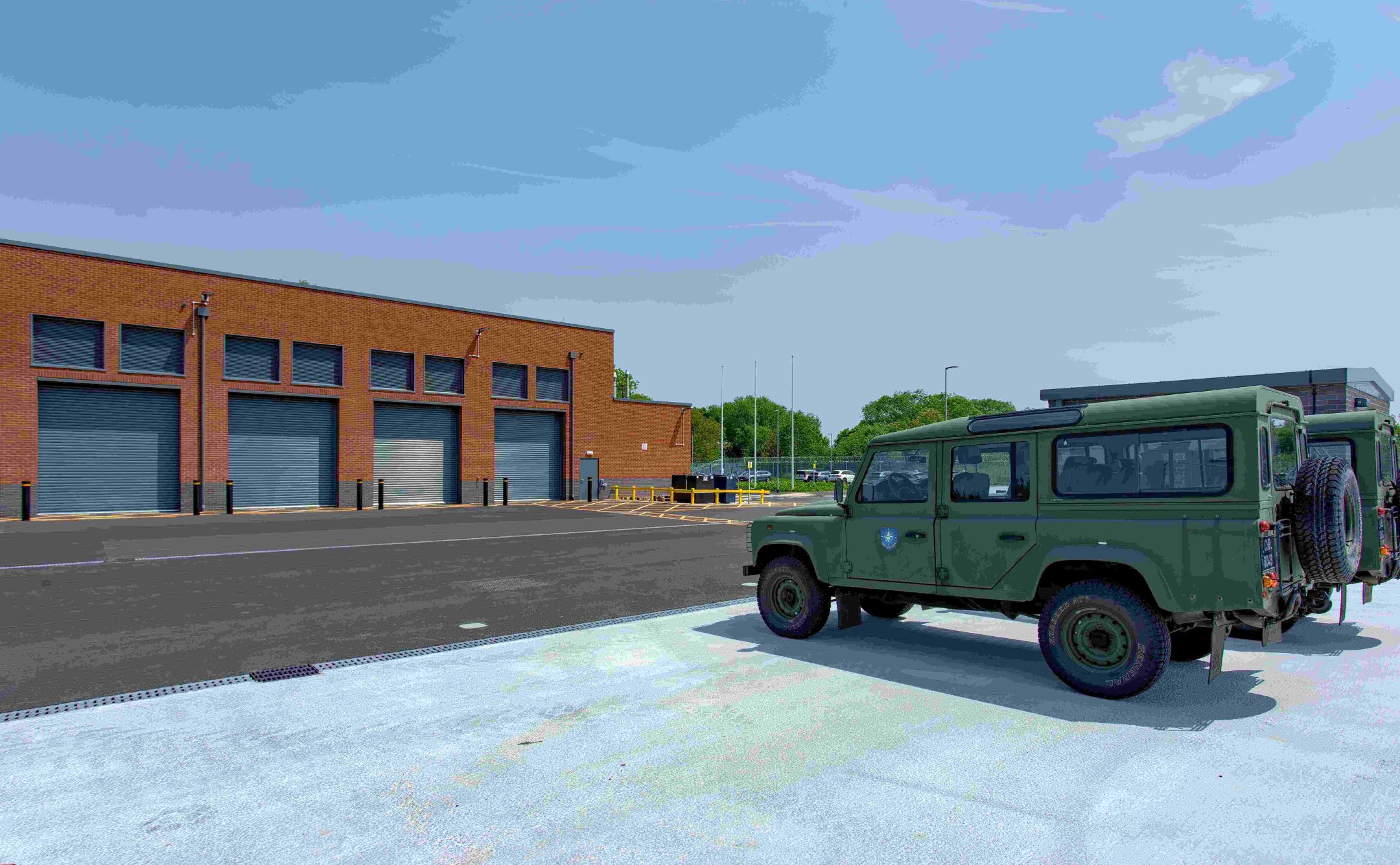 Outside shot of the garage with army truck infront