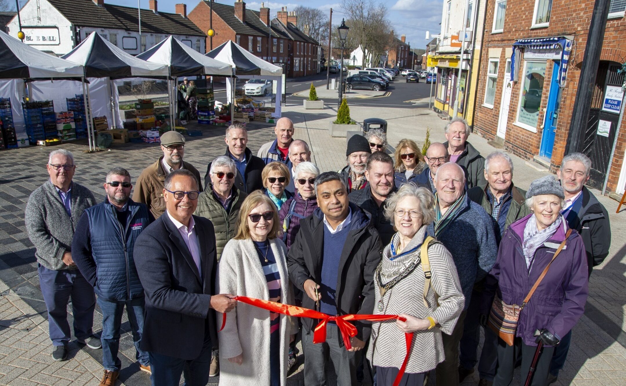 Stakeholders involved in the Shepshed Market Place cutting the ribbon