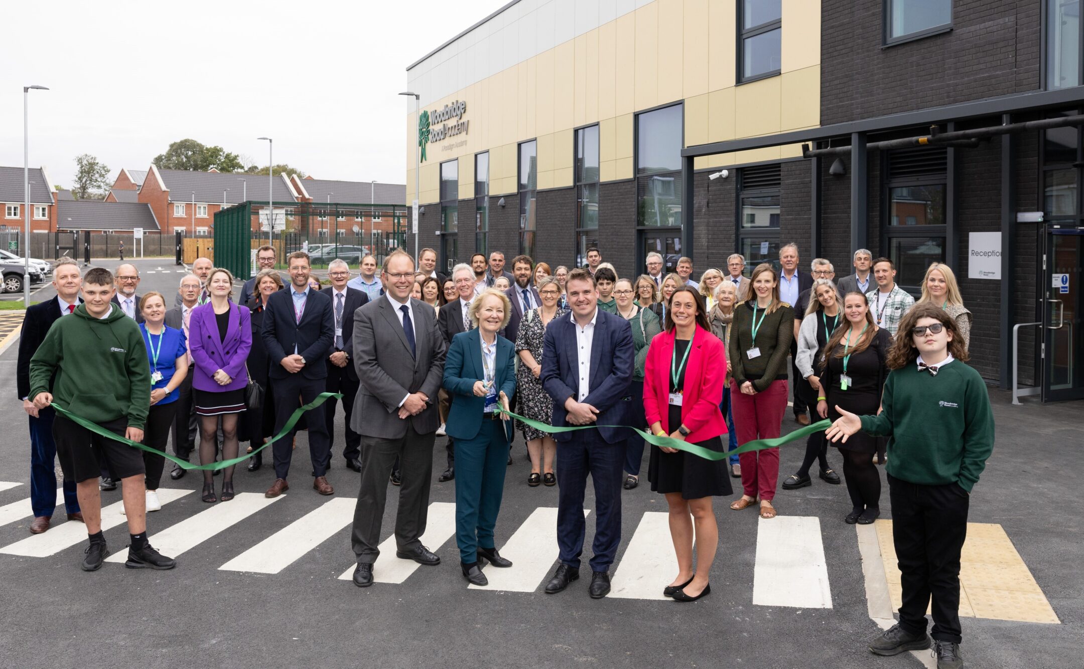 Staff and pupils open the new building