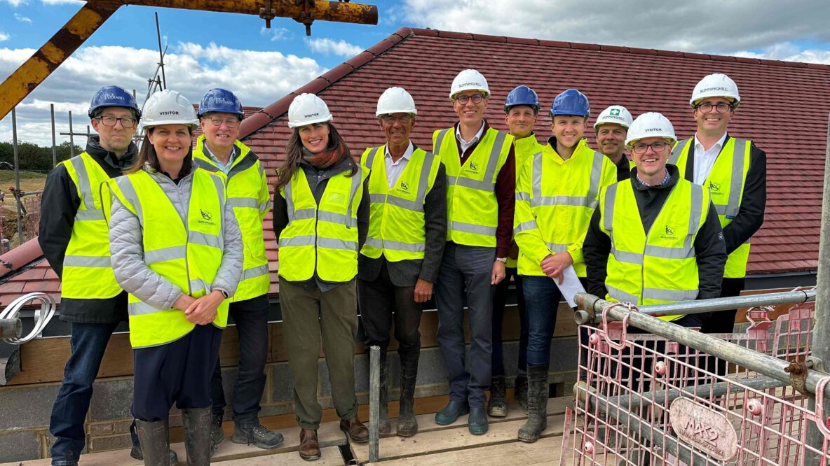 Project team standing together on top of scaffolding at Wealden Community Sports Hub