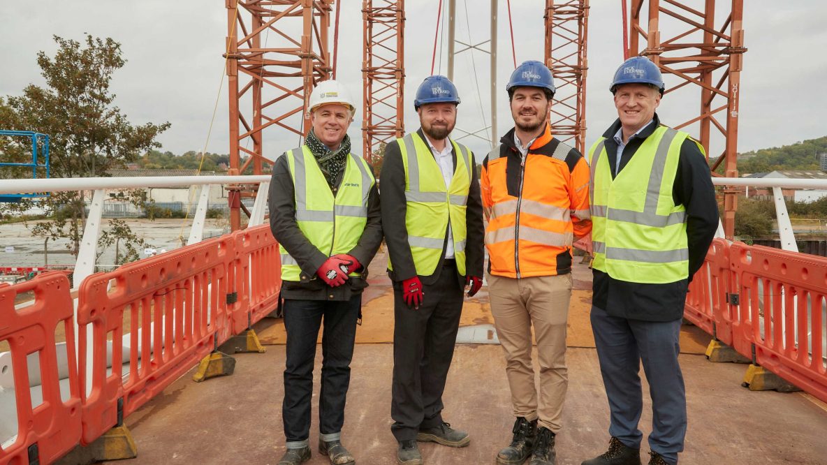 Pick Everard employees standing on bridge