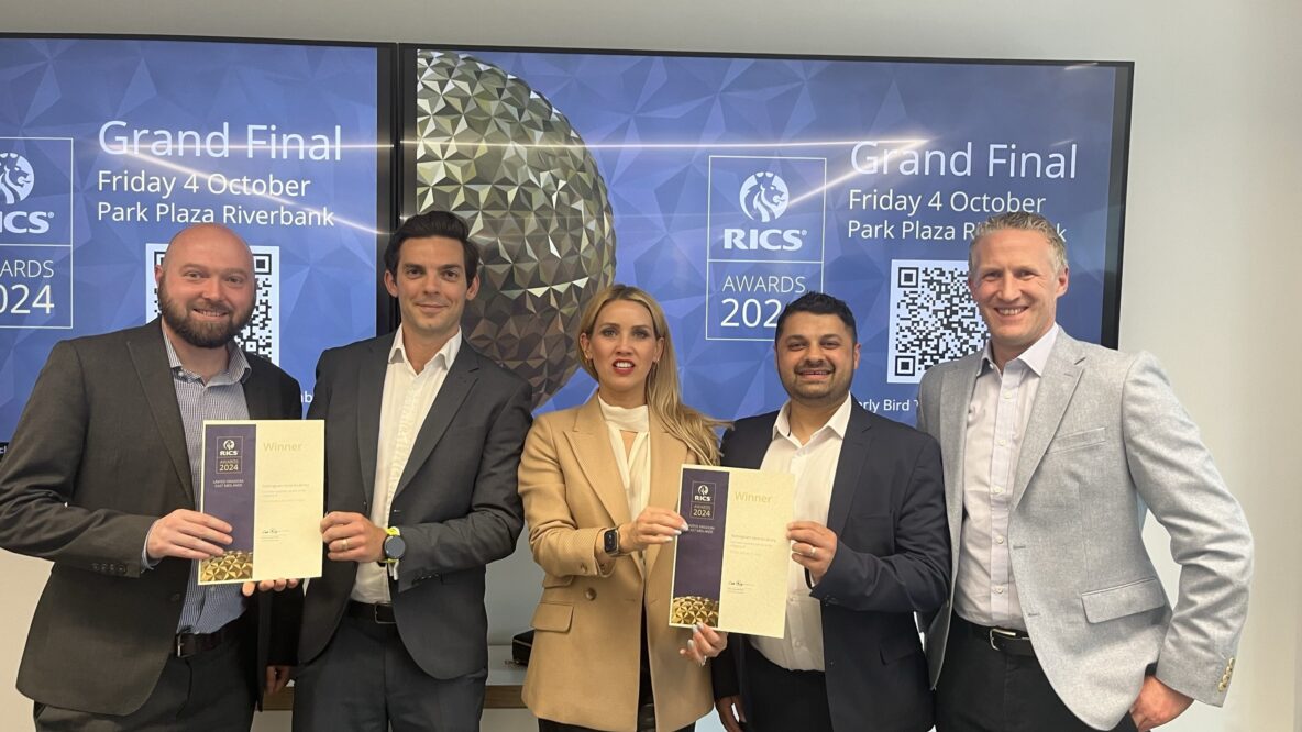 Group of people with RICS award certificates