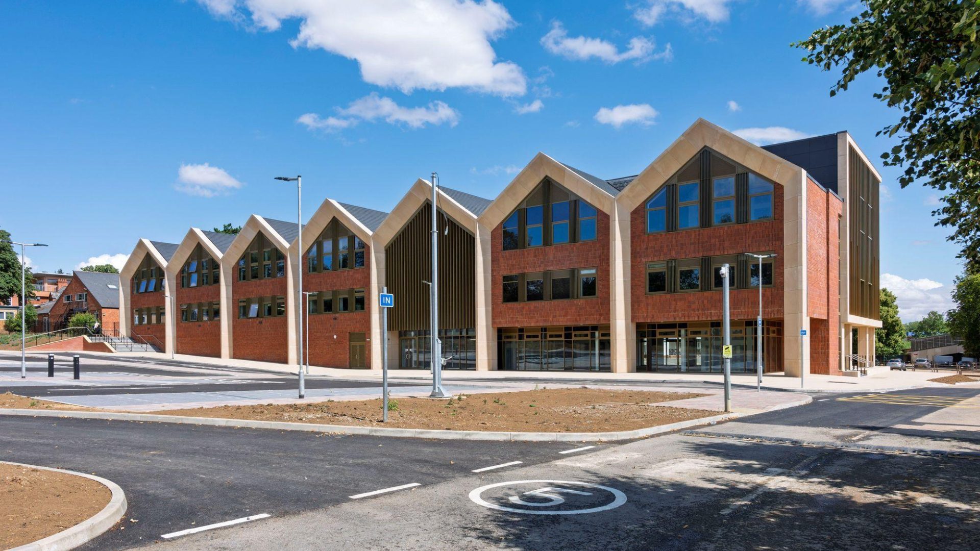 A new brick building featuring multiple windows, showcasing modern architectural design