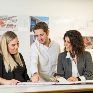 People looking at a document together