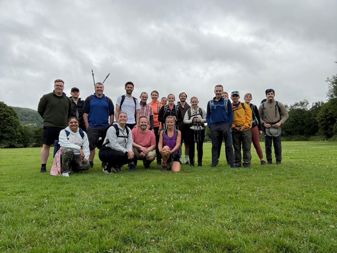 Group of people in hiking gear in a field