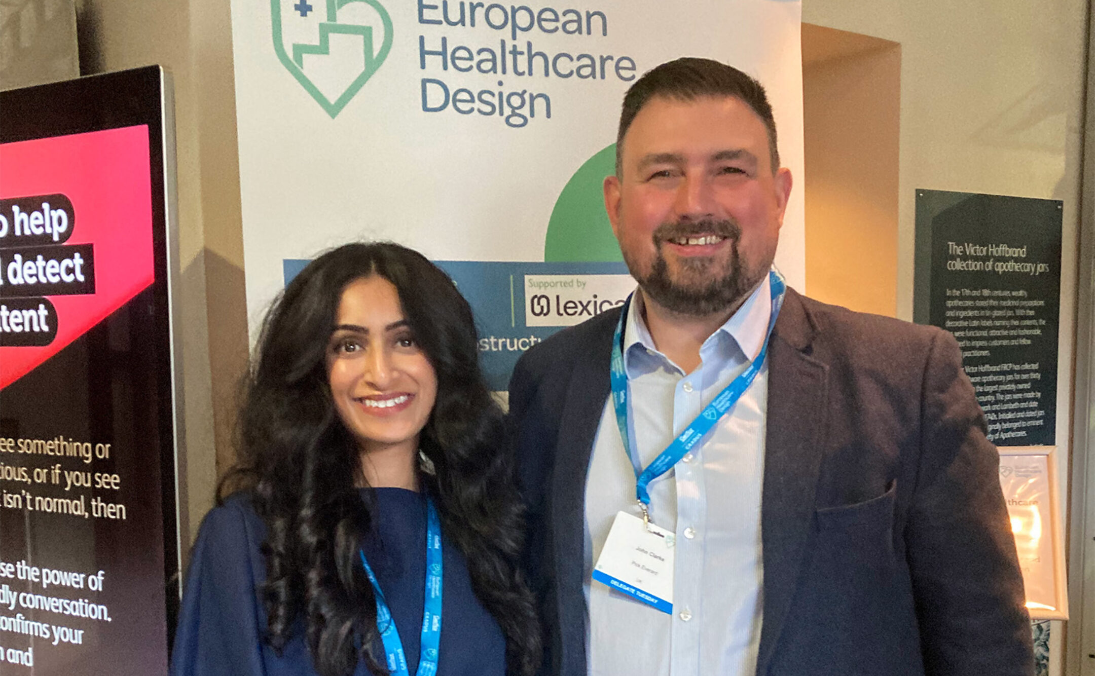 John and Devika stood together behind European Healthcare Design banner