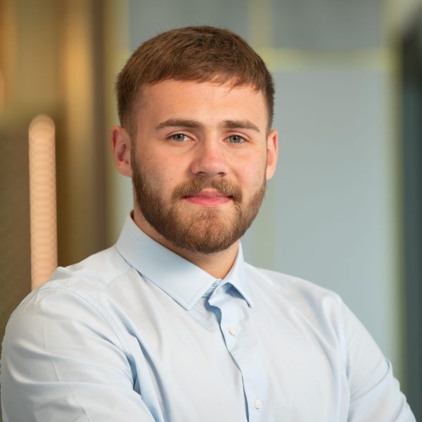 Man smiling at camera in modern office