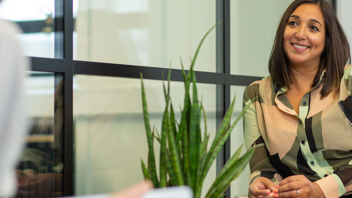 Two people sitting in an office