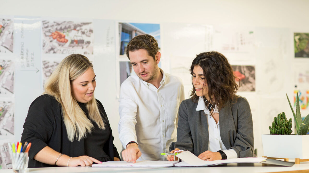 People looking at a document together