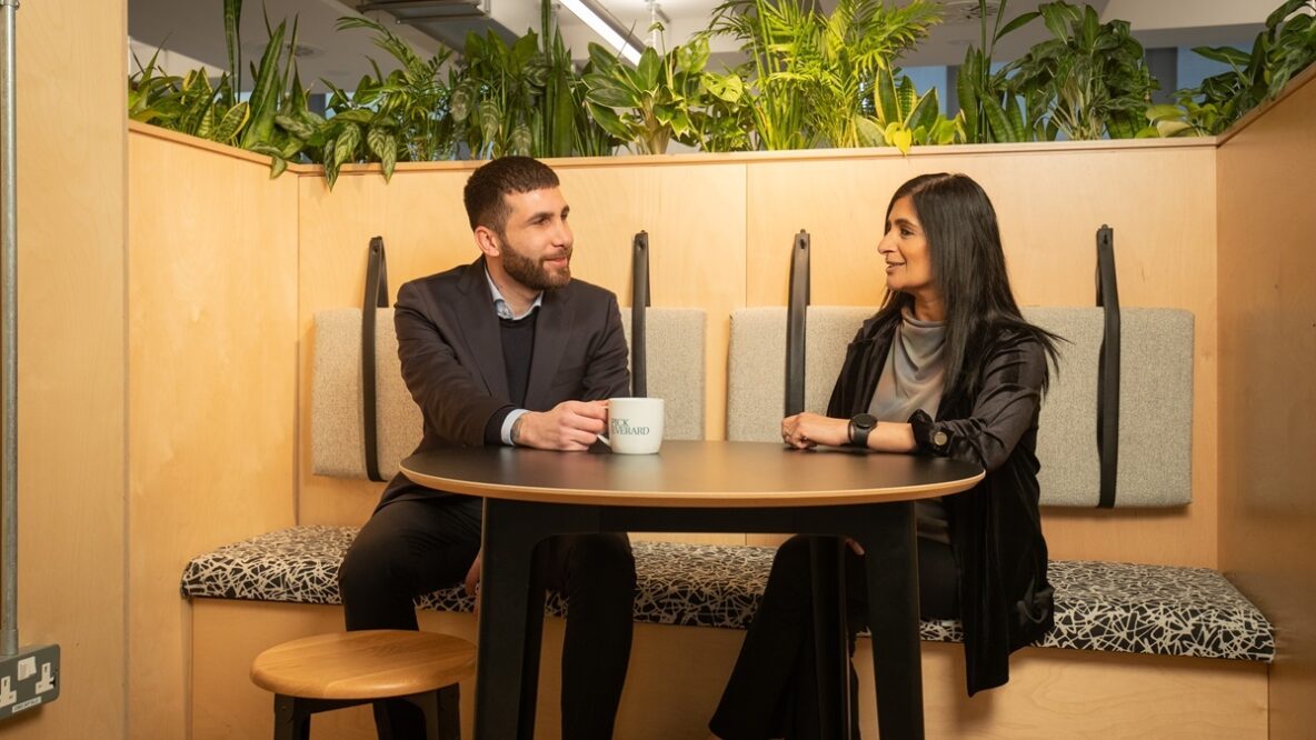 A couple of colleagues having coffee in the office