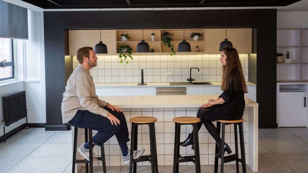 Two people in a office kitchen