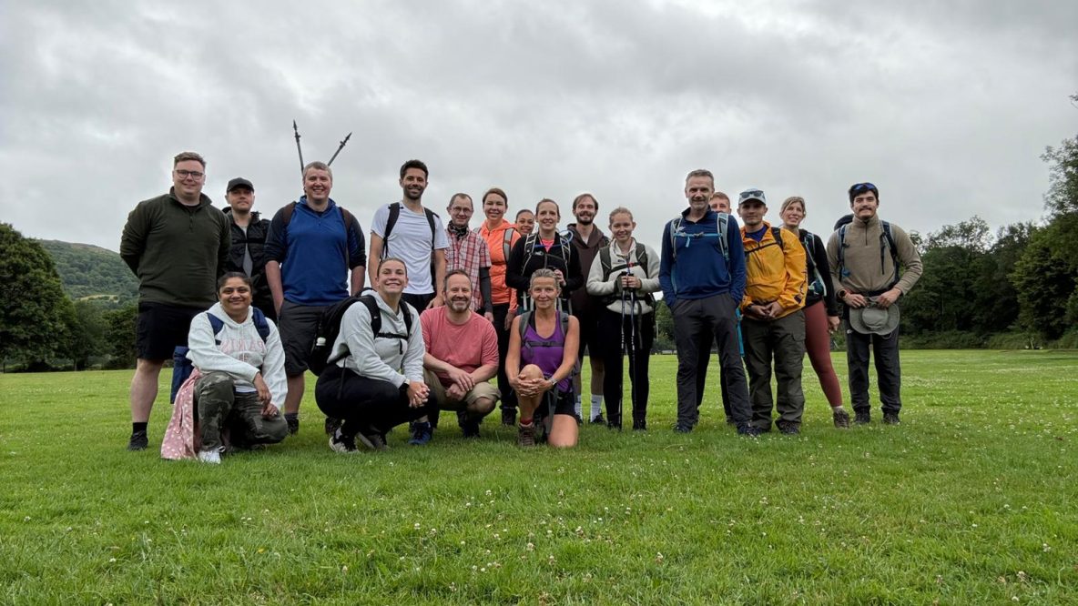 Group of people in hiking gear in a field