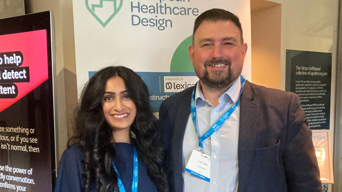 John and Devika stood together behind European Healthcare Design banner