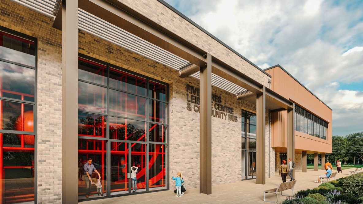 Exterior view of a modern brick and copper leisure centre and community hub with large windows revealing a vibrant red climbing structure inside, and people walking and sitting outside.