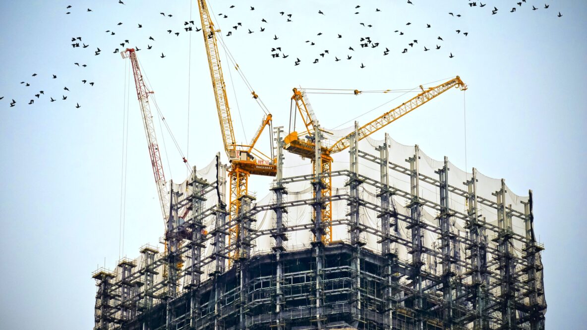 Cranes during construction of building