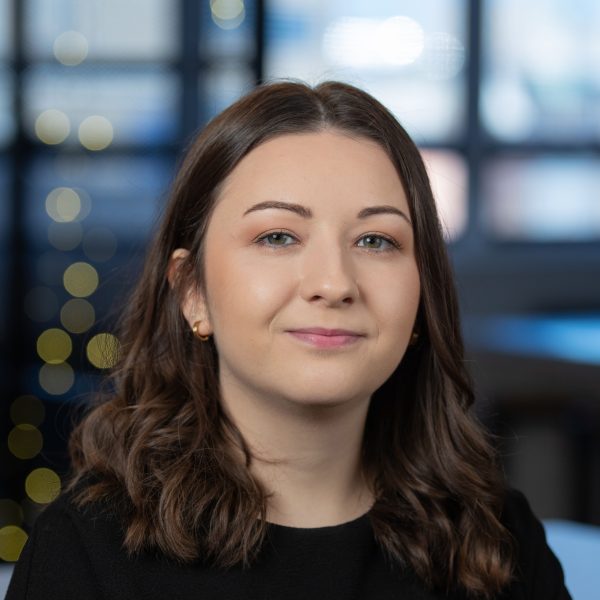 Girl with brown hair in a modern office environment