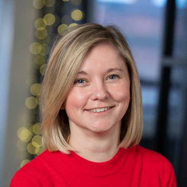 Hope in the office in a red shirt
