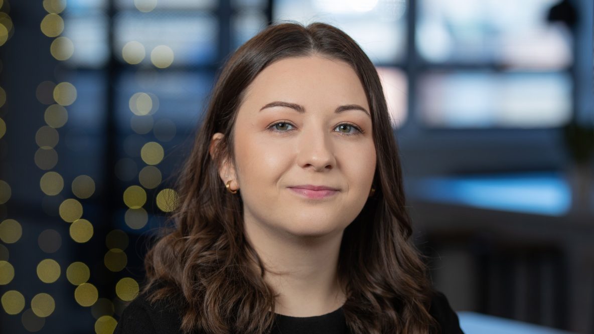 Girl with brown hair in a modern office environment
