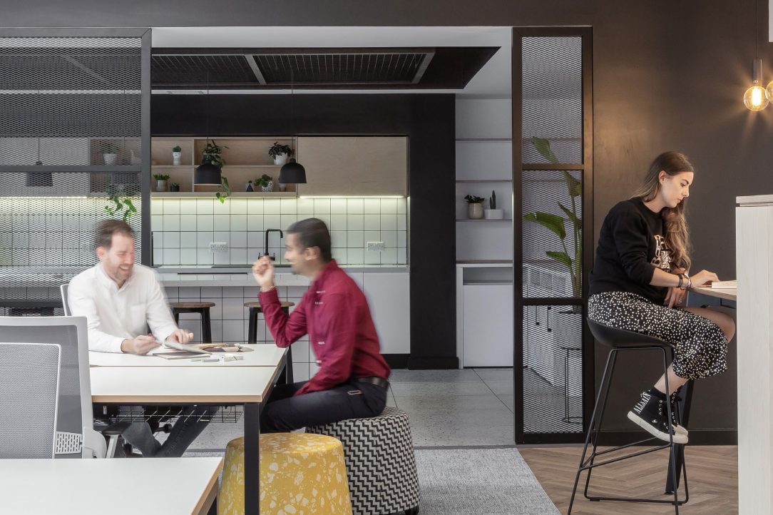 Two people chatting in a modern office